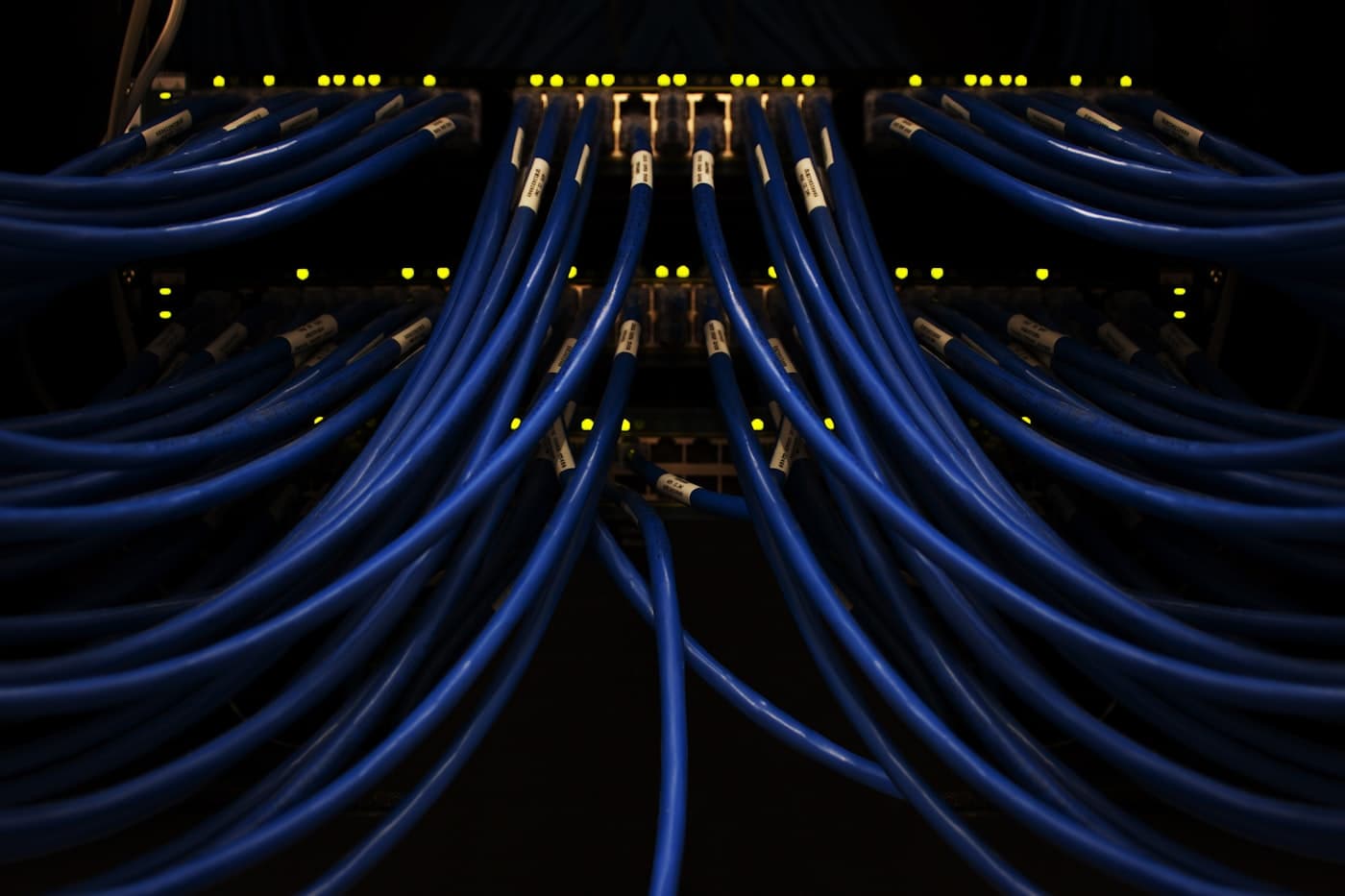 Symmetric blue network cabling representing Pinnacle AI's secured infrastructure